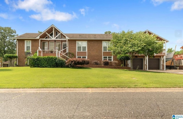 view of front of house featuring a garage and a front lawn