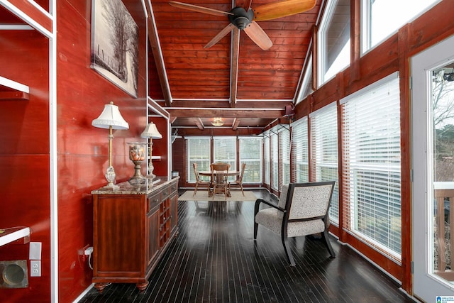 sunroom featuring vaulted ceiling with beams, wood ceiling, and ceiling fan