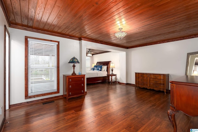 bedroom featuring dark hardwood / wood-style flooring, wood ceiling, and crown molding