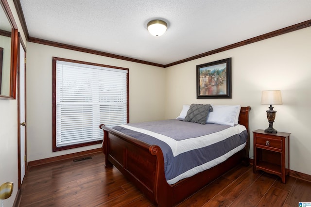 bedroom with ornamental molding, a textured ceiling, and dark hardwood / wood-style flooring