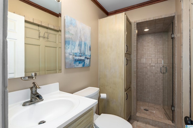 bathroom with crown molding, toilet, an enclosed shower, and vanity