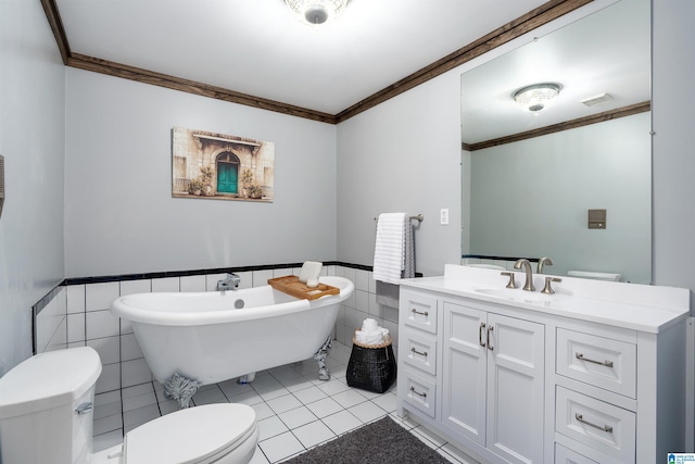 bathroom featuring a bathing tub, ornamental molding, tile walls, and vanity