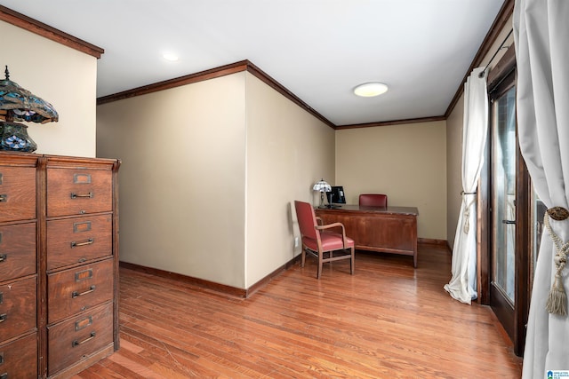 home office featuring ornamental molding and light wood-type flooring