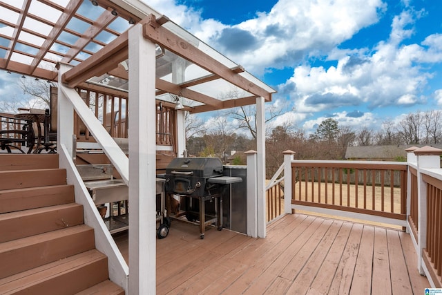 wooden terrace featuring grilling area