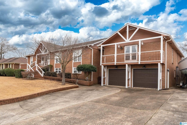 view of front of home featuring a garage and a balcony