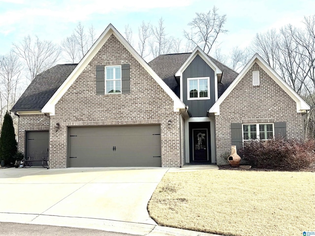 view of front of home featuring a garage and a front yard