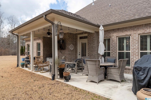 view of patio with a grill and ceiling fan