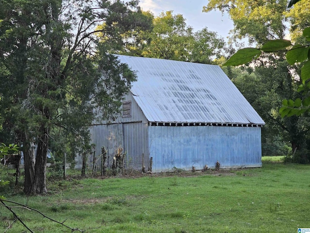 view of outbuilding with a lawn