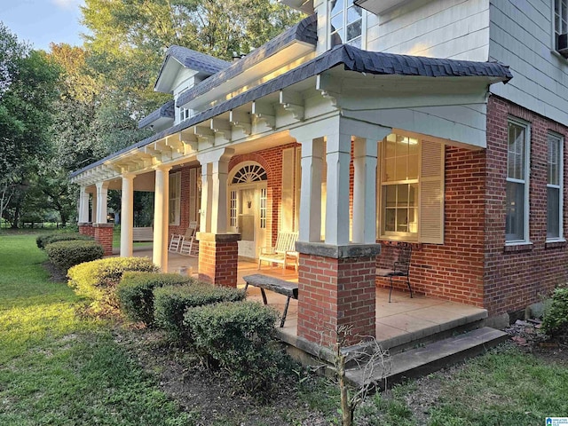 view of side of home with a porch