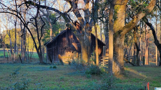 view of home's exterior featuring an outbuilding