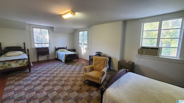 bedroom featuring cooling unit and multiple windows