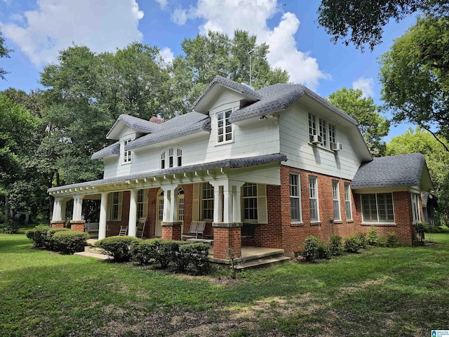 view of front of house with a front lawn and a porch