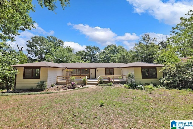 ranch-style home featuring a front yard