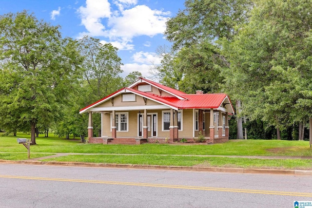 craftsman inspired home with a porch and a front yard