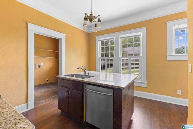 kitchen with sink, decorative light fixtures, dark brown cabinets, stainless steel dishwasher, and a wealth of natural light