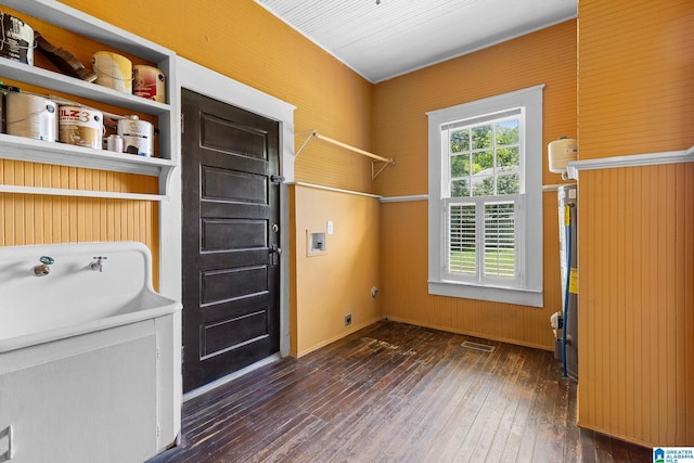 washroom featuring washer hookup, dark hardwood / wood-style flooring, and hookup for an electric dryer