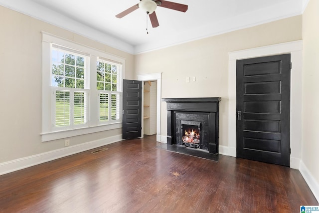 unfurnished living room with ornamental molding, dark hardwood / wood-style floors, and ceiling fan