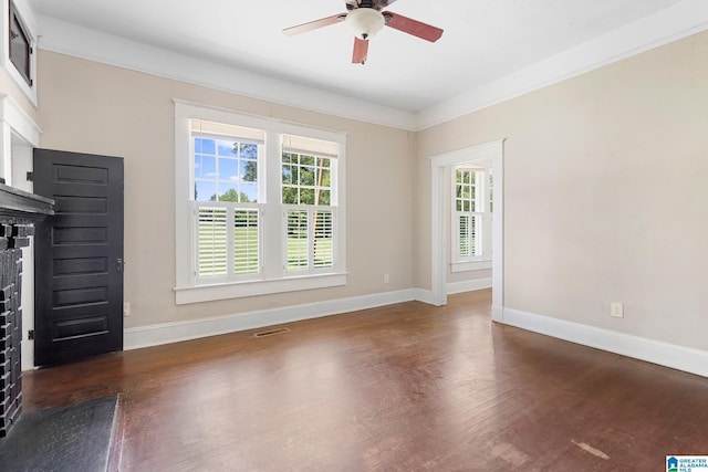 unfurnished living room with ceiling fan and dark hardwood / wood-style flooring