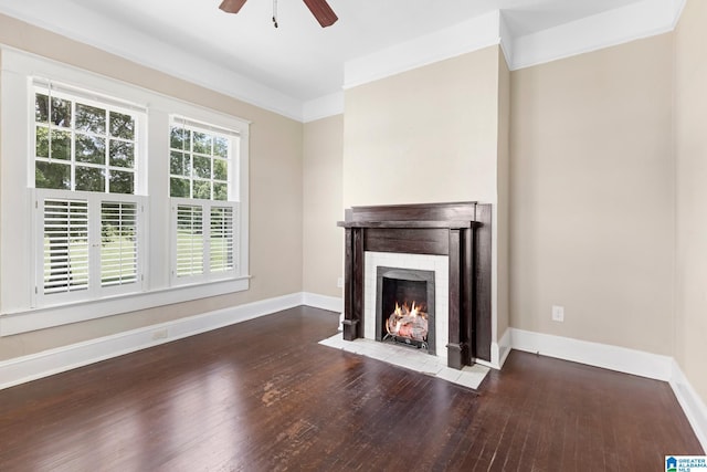 unfurnished living room with crown molding, ceiling fan, a fireplace, and hardwood / wood-style floors