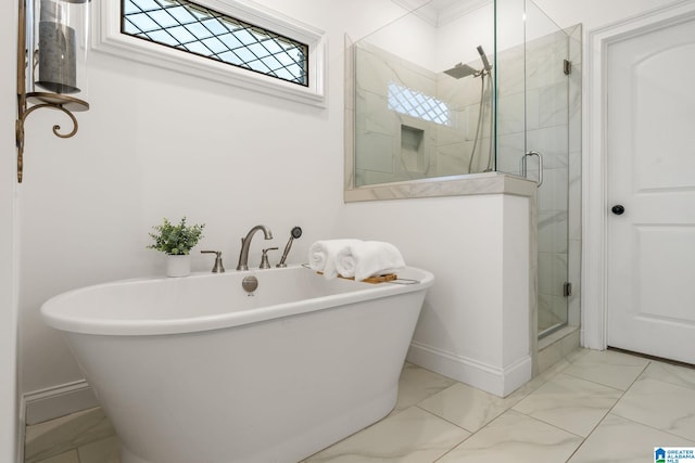 bathroom featuring shower with separate bathtub