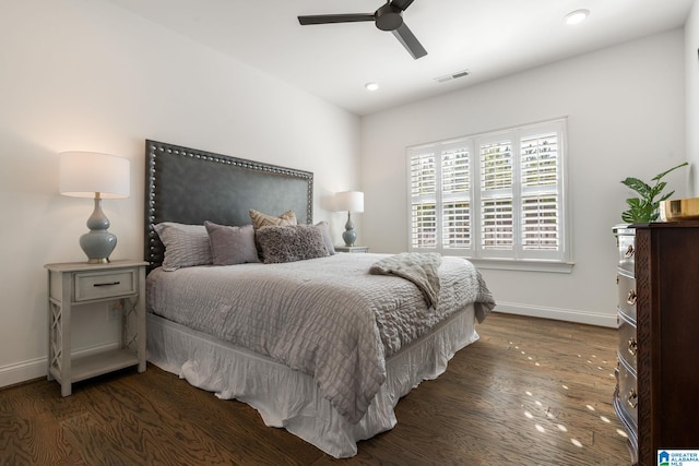 bedroom with dark wood-type flooring and ceiling fan