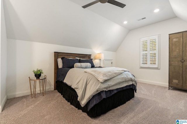 carpeted bedroom featuring vaulted ceiling and ceiling fan