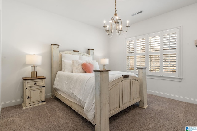 bedroom featuring carpet floors and a notable chandelier