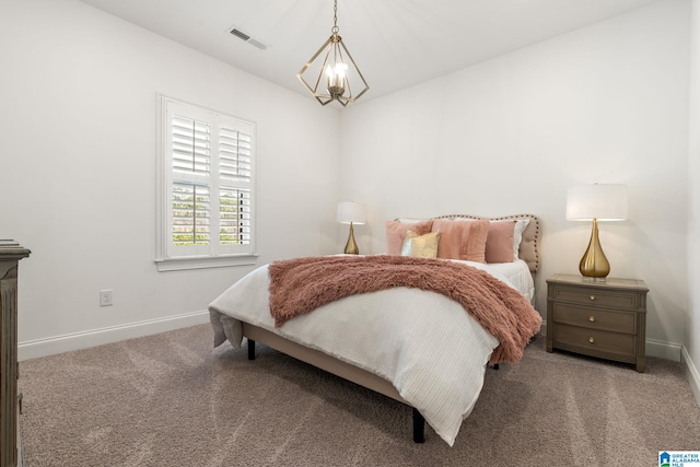 bedroom with a notable chandelier and carpet