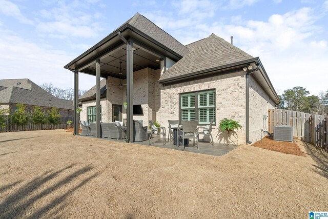 rear view of property featuring an outdoor hangout area, central AC, and a patio area