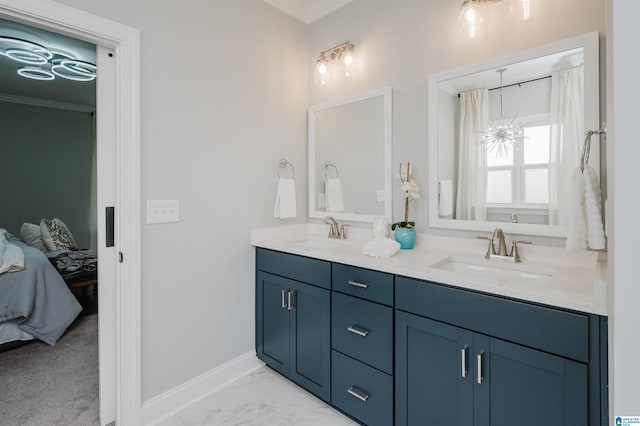 bathroom featuring vanity and a chandelier