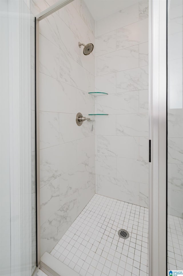 bathroom with tiled shower