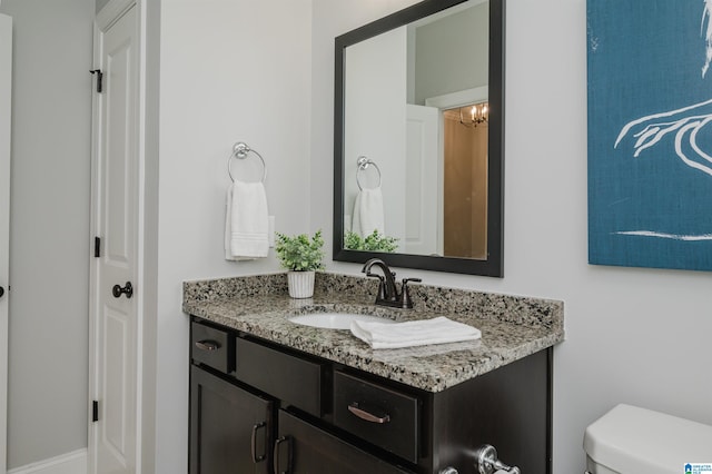 bathroom with vanity and toilet