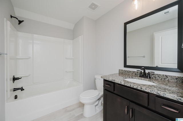 full bathroom with shower / bathtub combination, vanity, and toilet