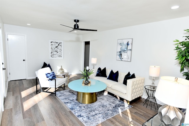 living room with hardwood / wood-style flooring and ceiling fan