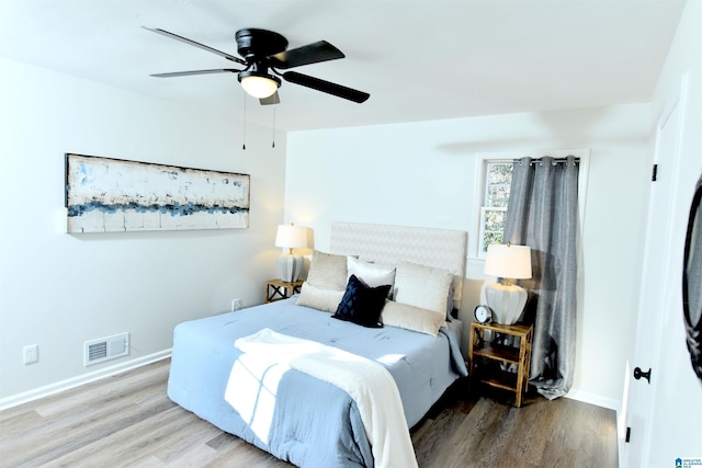 bedroom featuring hardwood / wood-style floors and ceiling fan