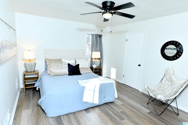 bedroom featuring wood-type flooring and ceiling fan