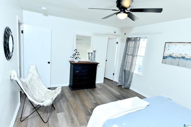 bedroom with ceiling fan and hardwood / wood-style floors