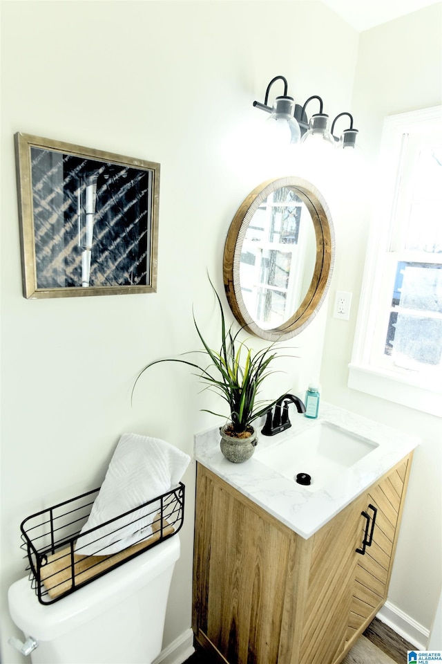 bathroom with vanity and toilet