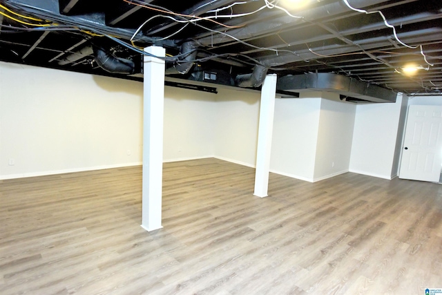 basement featuring hardwood / wood-style flooring