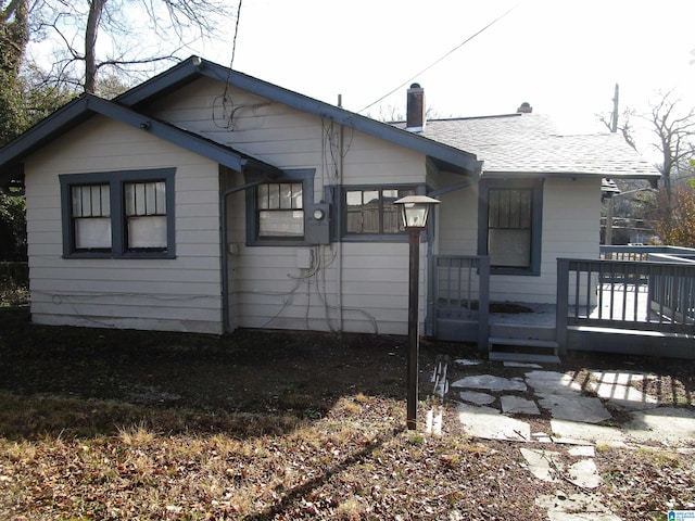 back of house featuring a deck