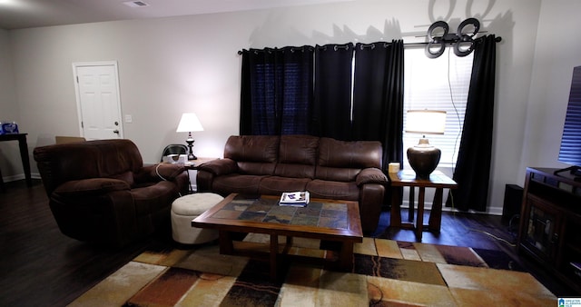 living room featuring dark hardwood / wood-style flooring