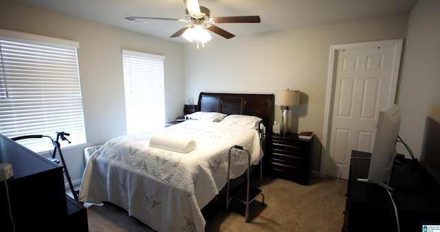 carpeted bedroom featuring ceiling fan