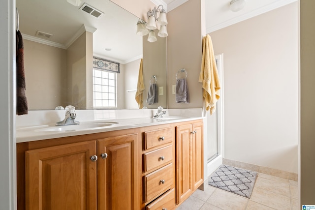 bathroom featuring ornamental molding, tile patterned floors, and vanity