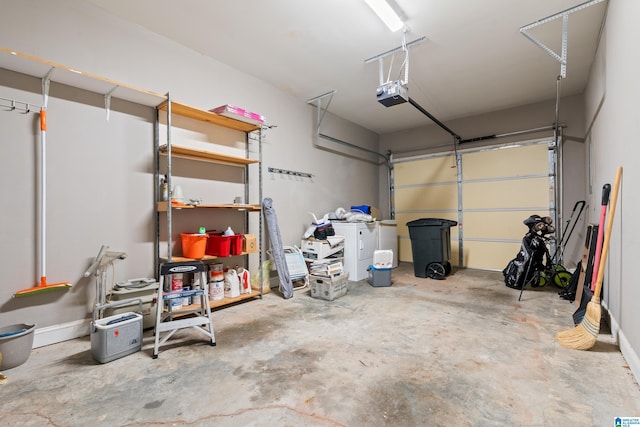 garage with a garage door opener and washer / dryer