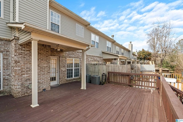 deck with central AC unit and ceiling fan