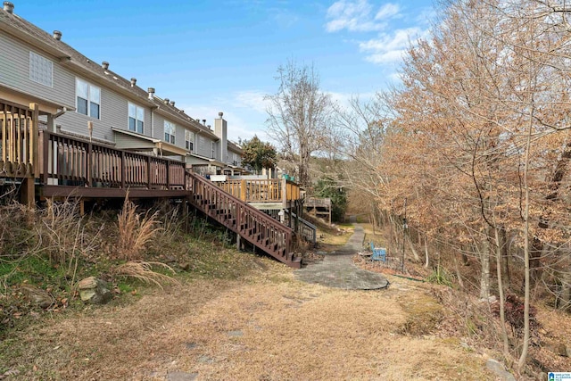 view of yard with a wooden deck