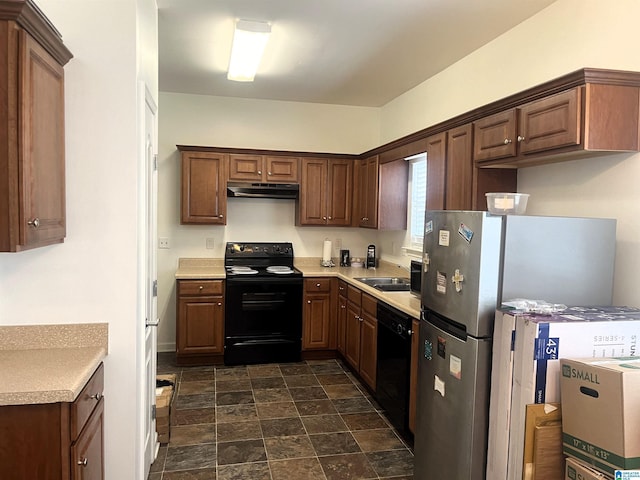 kitchen featuring sink and black appliances