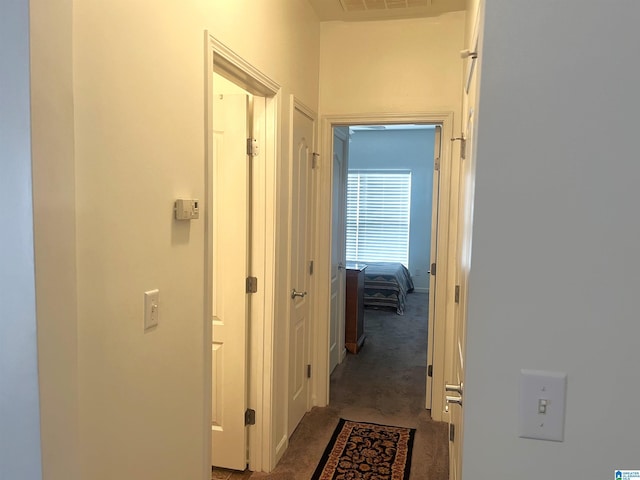 corridor with carpet floors