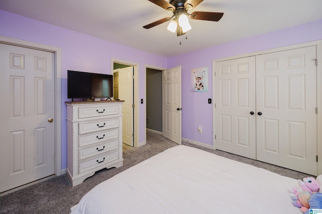 carpeted bedroom with ceiling fan and a closet