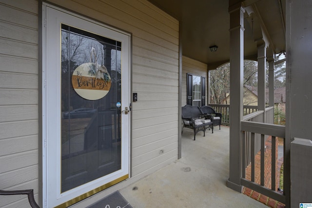 doorway to property featuring covered porch